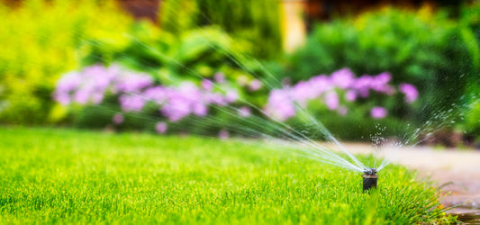 automatic sprinkler system watering lawn